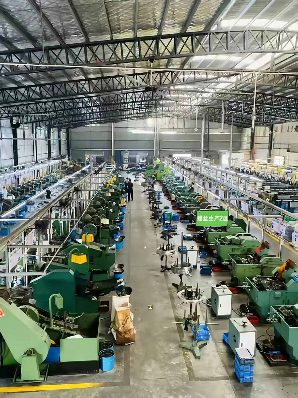 Fastener manufacturing workshop with rows of production machines at LD Screw