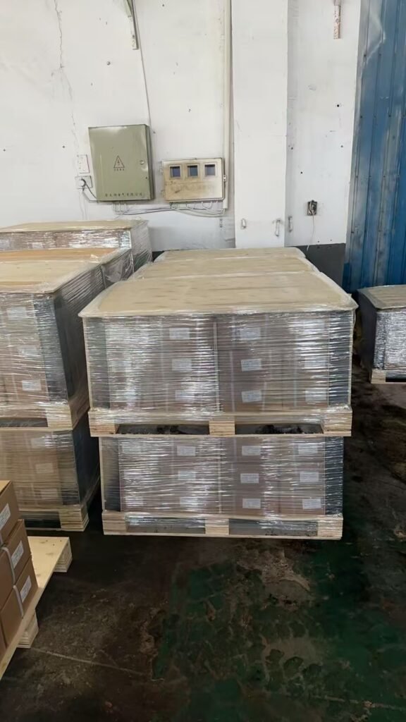 Fastener cartons stacked on wooden pallets and wrapped for export